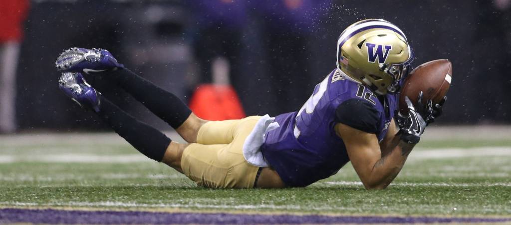 DUPLICATE***Washington Huskies wide receiver Aaron Fuller (12) dives for the ball, and fails, as the Washington State Cougars lost to the Washington Huskies 41-14 at Husky Stadium in the 110th Apple Cup on Saturday, Nov. 25, 2017 in Seattle, Wa. (Andy Bronson / The Herald)