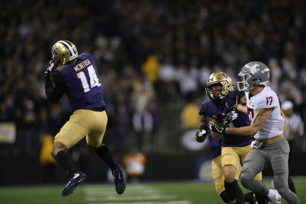 Washington Huskies defensive back JoJo McIntosh (14) intercepts a pass as the Washington State Cougars lost to the Washington Huskies 41-14 at Husky Stadium in the 110th Apple Cup on Saturday, Nov. 25, 2017 in Seattle, Wa. (Andy Bronson / The Herald)