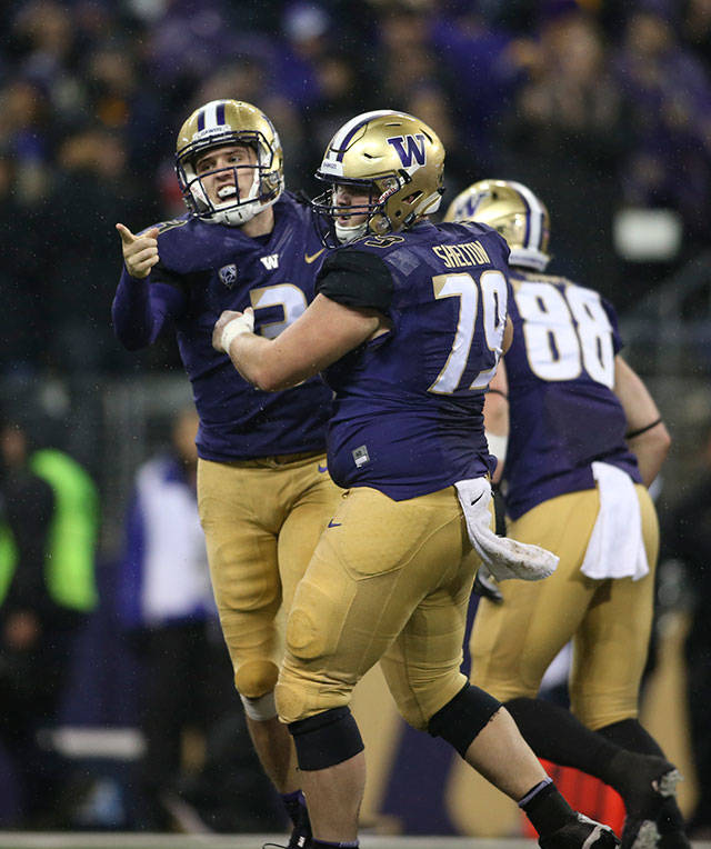 Washington Huskies quarterback Jake Browning (3) celebrates his touchdown as the Washington State Cougars lost to the Washington Huskies 41-14 at Husky Stadium in the 110th Apple Cup on Saturday, Nov. 25, 2017 in Seattle, Wa. (Andy Bronson / The Herald)