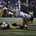 Washington State Cougars running back Jamal Morrow (25) is upended as he gains a few yards as the Washington State Cougars lost to the Washington Huskies 41-14 at Husky Stadium in the 110th Apple Cup on Saturday, Nov. 25, 2017 in Seattle, Wa. (Andy Bronson / The Herald)