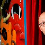 A wall in Justin Hillgroves studio yields to a red theater-curtain passway to another work area. (Dan Bates / The Herald)
