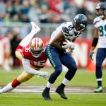 Wilson throws for 2 TDs, runs for another as Seahawks win