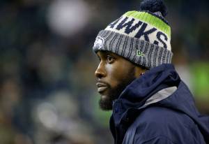 Injured Seattle Seahawks strong safety Kam Chancellor stands on the field before an NFL game against the Atlanta Falcons on Nov. 20, 2017, in Seattle. (AP Photo/Ted S. Warren)