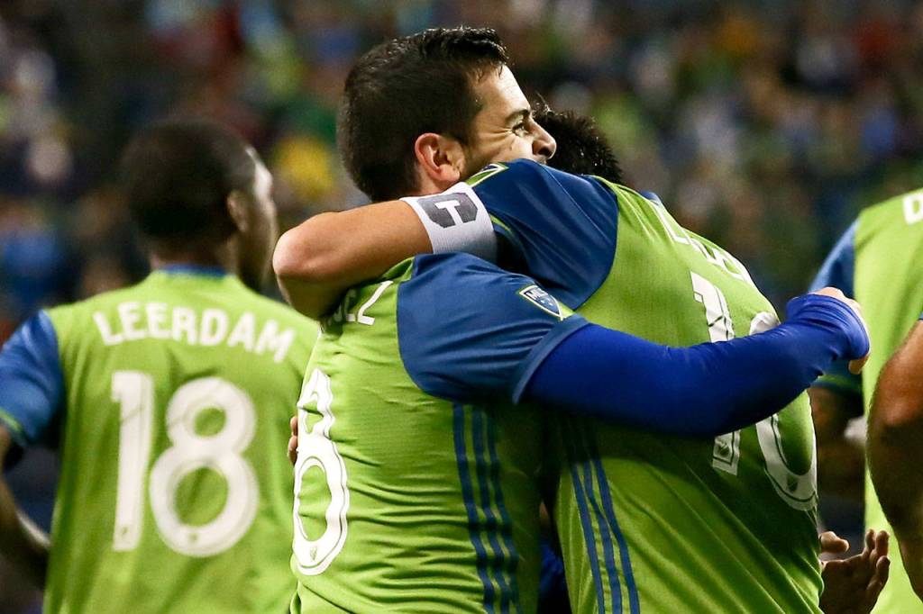 The Sounders Victor Rodriguez (left) and Nicolas Lodeiro celebrate after Rodriguezs goal in the first half of the second leg of the Western Conference finals on Nov. 30, 2017, at CenturyLink Field in Seattle. (Kevin Clark / The Herald)