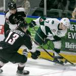The Silvertips Matt Fonteyne (right) controls the puck with Vancouvers Alex Kannok Leipert (left) and Tyler Popowich giving chase in the first period of a game Dec. 29, 2017, at Angel of the Winds Arena in Everett. (Kevin Clark / The Herald)