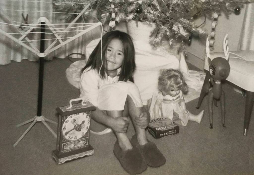 Sue Misao, age 4 or 5-ish, with her befuddling Christmas presents at her home in Monrovia, California. (June Christensen)