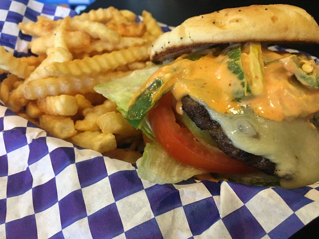 The Fire Alarm burger has all the trimmings plus jalapeno peppers, spicy sauce and pepperjack cheese. (Ben Watanabe / The Herald)