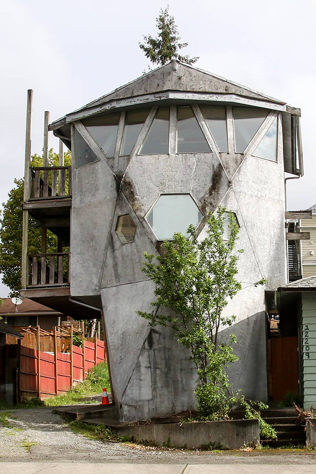 The odd-shaped gray three-story house has been a Lake Stevens eyesore and icon for 40 years. Its been called the shipwrecked lighthouse, Darth Vader House, Flintstone House, The Dr. Seuss House, Rapunzels Tower, Prison guard tower, Volkswagen Bus House or the Hobbit House. (Kevin Clark / The Herald)