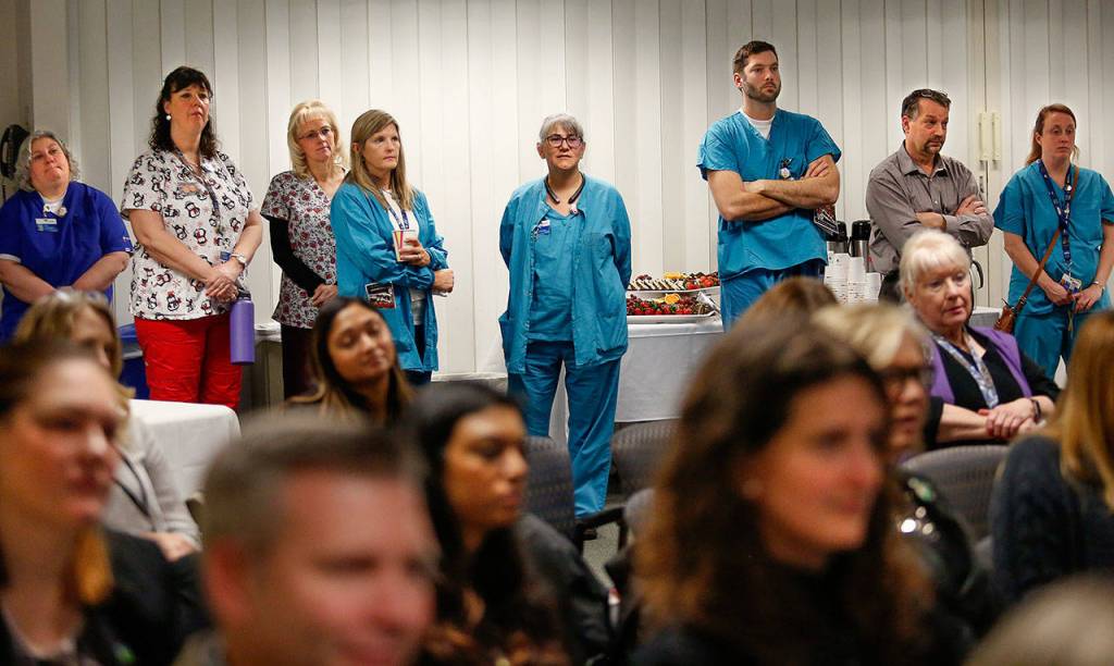 Even as the Cascade room at Providence Regional Medical Center Everett filled up Thursday, staff continued to gather as Parker Lang, a young Mill Creek man who was struck by a car and died March 11, 2016, is honored for saving lives through organ donation. (Dan Bates / The Herald)