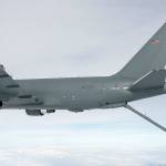 Boeings first KC-46 aerial-refueling tanker deploys its boom during a test flight with a U.S. Air Force fighter jet. The tanker is based on Boeings 767 and assembled in Everett. (Boeing Co.)
