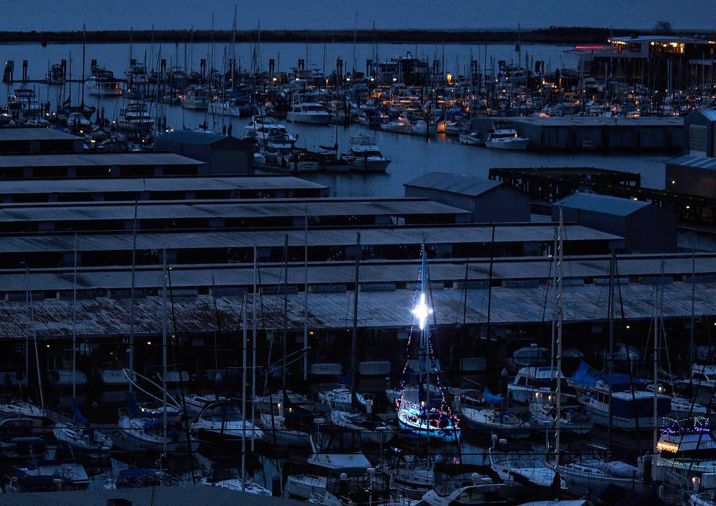 A few boat owners at Everett Marina were in a festive spirit this week, stringing lights on their mast and bow rails. (Dan Bates / The Herald)