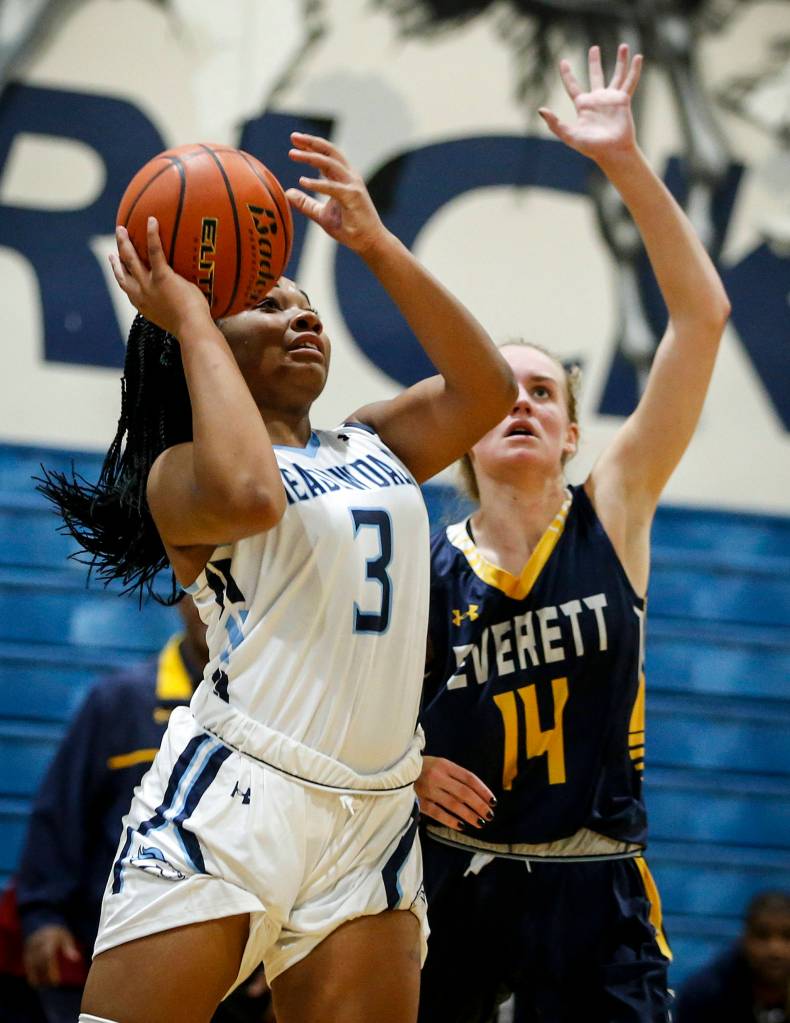 Meadowdales Alicia Morrison (3) goes up for a shot as Everetts Kate Pohland (14) defends during a game at Meadowdale High School in Lynnwood on Nov. 28. (Ian Terry / The Herald)