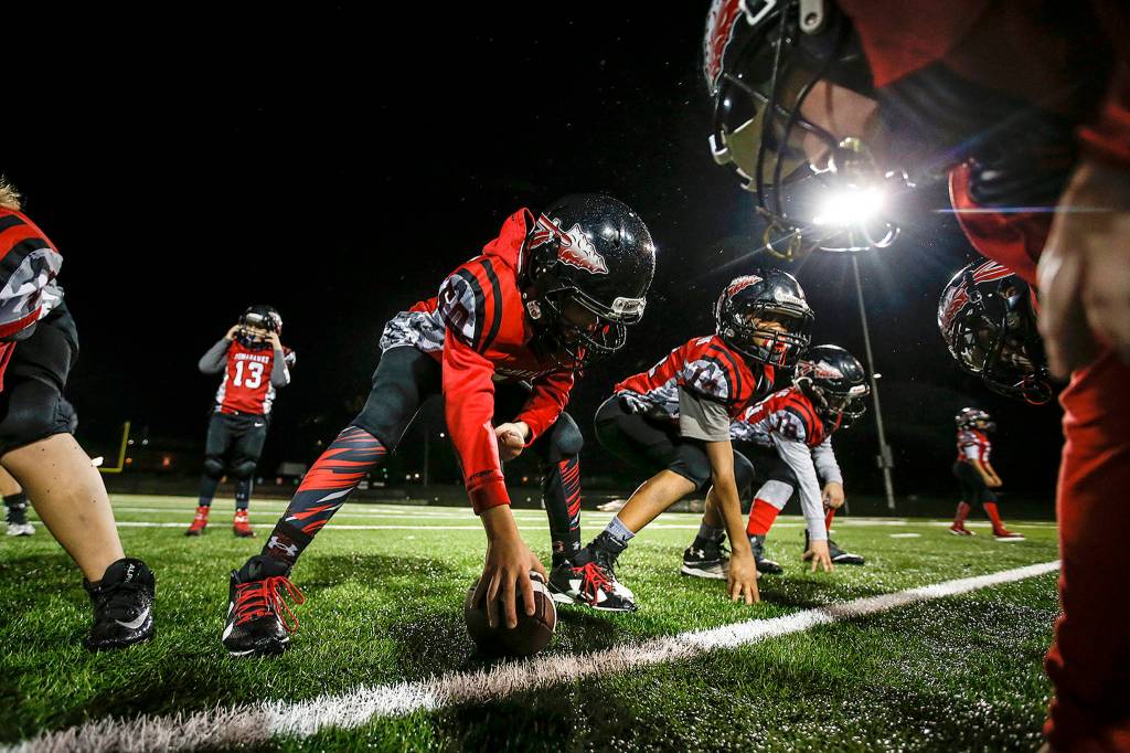 The Marysville Pilchuck Tomahawk Red 89ers practice at Tulalip Field on Nov. 21. (Ian Terry / The Herald)