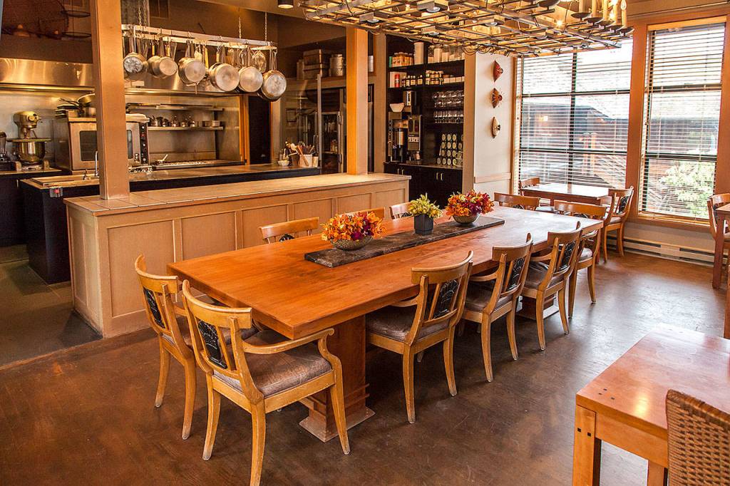 The open kitchen at the Inn at Langley features a rustic wood farm-style table. (Photo courtesy of the Inn at Langley)                                The open kitchen at the Inn at Langley features a rustic wood farm-style table. (Photo courtesy of the Inn at Langley)