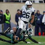 Penn States Saquon Barkley (26) is stopped by Michigan States Matt Sokol on a punt return during the first half of a game Nov. 4, 2017, in East Lansing, Mich. (AP Photo/Al Goldis)