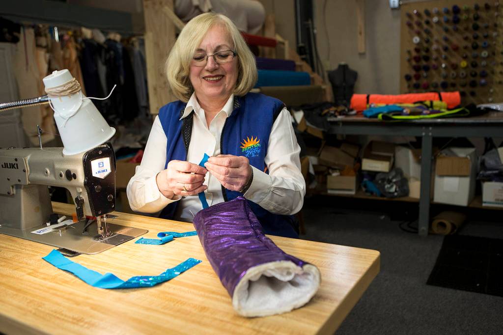 Zentek Clothing CEO Janice Kajanoff sews products at the companys Everett office on Wednesday, Nov. 15. (Ian Terry / The Herald)