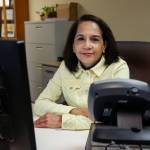 Laura Nathan has tended the front desk at Homage three days a week for nearly a year. (Dan Bates / The Herald)