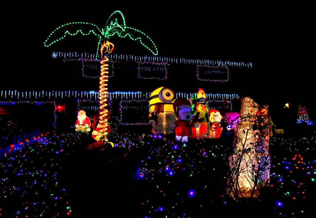 John and Debbie Taylors home is decorated with Spiderman, Snoopy, Yoda as Santa, Winnie the Pooh, Darth Vader and a manger scene.