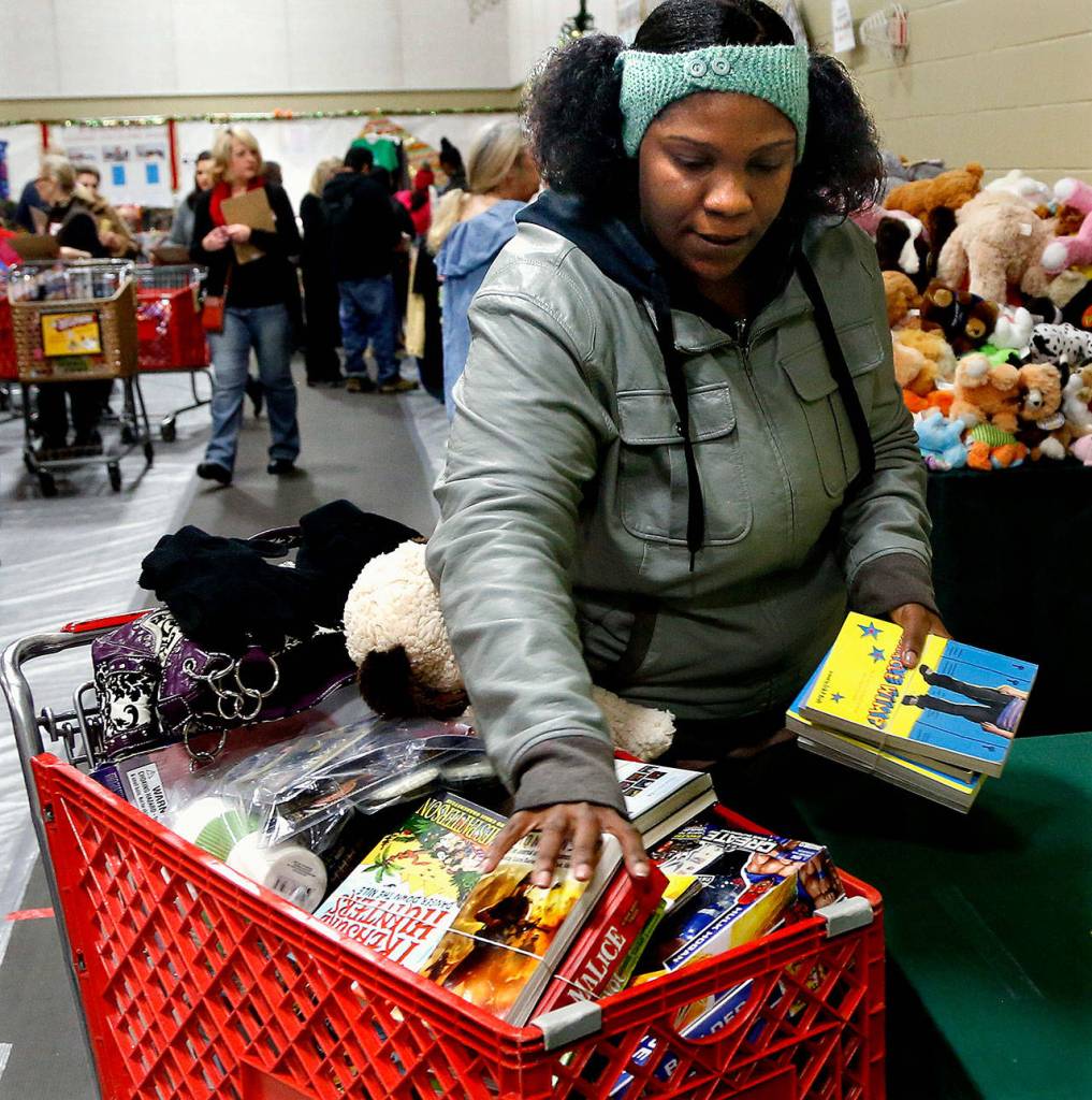 Latresha Fulson has four boys ages 9 to 18, including a set of twins. The Lynnwood mom said that without Christmas House, this year would be tough. (Dan Bates / The Herald)