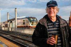 Longtime train buff Mark Garcia, of Everett lost two friends who were fellow rail enthusiasts in Mondays Amtrak derailment south of Tacoma. Those friends, Jim Hamre and Zack Willhoite, had often taken train trips with Garcia, shown here Thursday as an Amtrak train leaves Everett Station for Vancouver, B.C. (Dan Bates / The Herald)