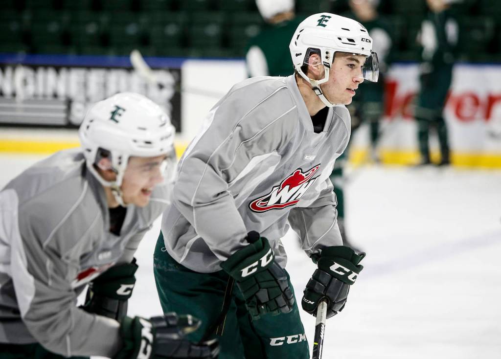 Silvertips winger Bryce Kindopp (right) skates during practice on Dec. 13, 2017, at Angel of the Winds Arena in Everett. (Ian Terry / The Herald)