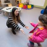 Michaela Andrade rushes to hug her former teacher, Maya Garcia, during an open house for students at the new Lake Stevens Early Learning Center on Friday in Lake Stevens. (Andy Bronson / The Herald)