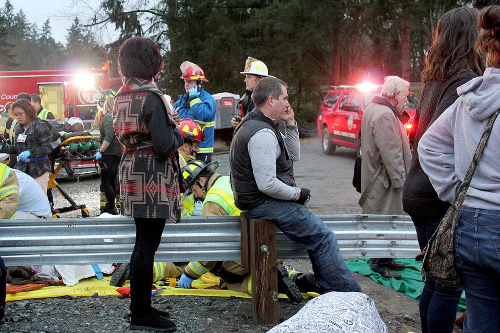 First responders work at the scene of an Amtrak train that derailed near DuPont on Monday. (Daniella Fenelon via AP)