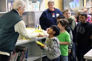 Tualco Grange hands out dictionaries to Monroe third-graders