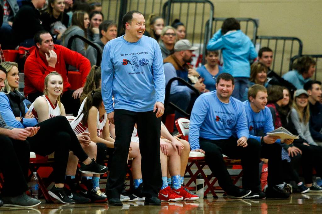 Snohomish head coach Ken Roberts talks with officials a during a game against Glacier Peak on Dec. 19, 2017, at Snohomish High School. (Ian Terry / The Herald)