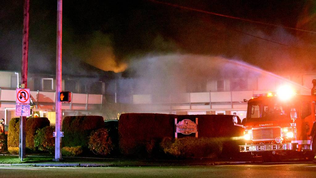 Many of the residents at Colby Square Apartments in Everett are elderly, neighbors said. One helped rescue an elderly woman in a wheelchair from the first floor. (Caleb Hutton / The Herald)