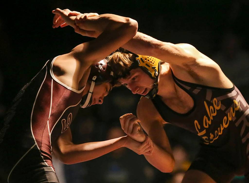 South Kitsaps Devon Gentz and Kyle LaCoursiere of Lake Stevens work for an advantage at Lake Stevens High School on Dec. 21. (Kevin Clark / The Daily Herald)