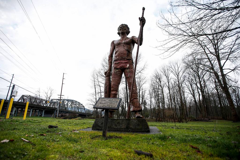 A 12-foot statue of Sultan John  or Tseul-Ted  is seen in Sultan on Dec. 15. A new pedestrian bridge planned in Sultan will mean the statue will need to be temporarily moved. (Ian Terry / The Herald)