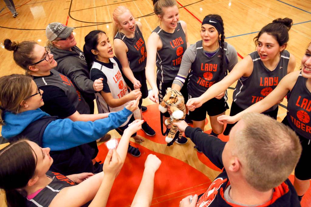 The Granite Falls High School girls basketball team rallies after practice on Dec. 19, as they prepared for their tournament trip to Alaska. (Kevin Clark / The Daily Herald)