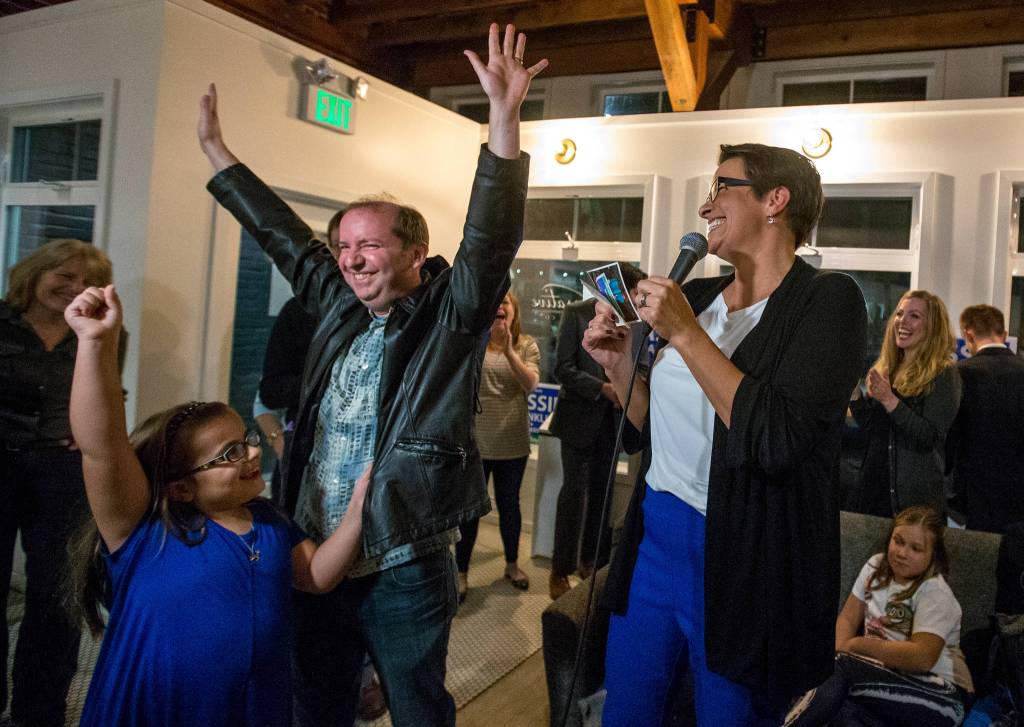Mayoral candidate Cassie Franklin is cheered by daughter Panda and husband David as she thanks supporters on election night at Narrative Coffee on Nov. 7 in Everett. Franklin narrowly won the election. (Andy Bronson / The Herald)