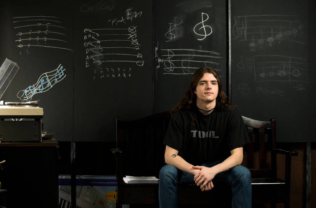 Crossroads High School senior Jacob Kerst in the music room on March 16 in Granite Falls. Kermit teaches guitar to others and is looking to eventually work in environmental science and journalism. (Andy Bronson / The Herald)