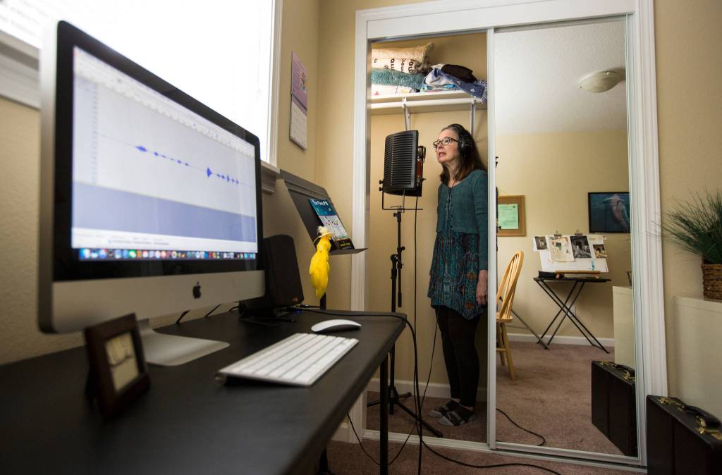 A computer records her voice as Saacha K. Belgar uses her closet as a recording studio on May 24 in Snohomish. (Andy Bronson / The Herald)
