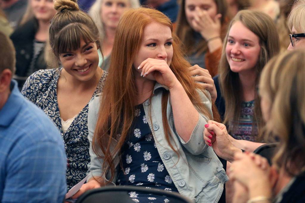 Juliana Marlaine is congratulated after receiving a $15,000 scholarship at Marysville Arts & Technology High School on May 24. Sponsored by the Marysville Rotary Club, more than $120,000 in scholarships were awarded during the annual ceremony. (Kevin Clark / The Herald)