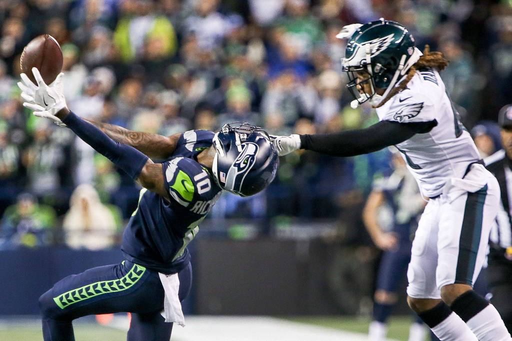 Seahawks wide receiver Paul Richardson tries to catch a pass under pressure from the Eagles Ronald Darby at CenturyLink Field in Seattle on Dec. 3. Seattle won 24-10. (Kevin Clark / The Herald)