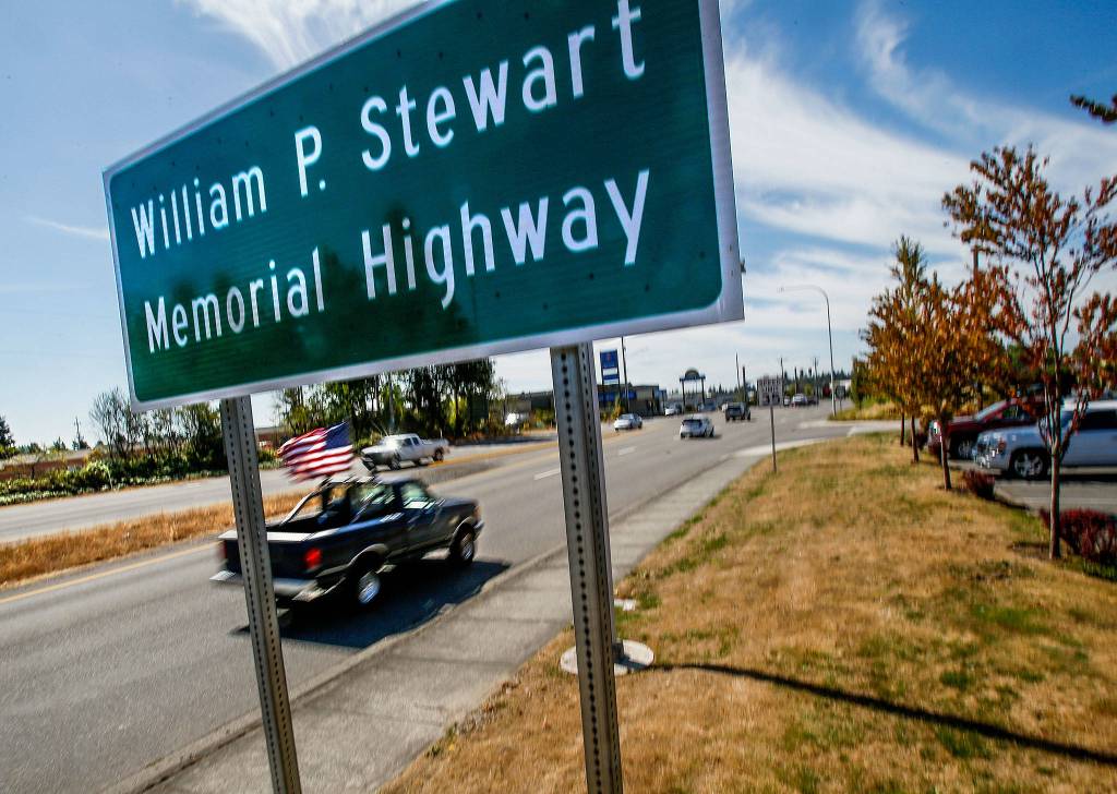 Southbound drivers get a glimpse Aug. 8 of a new state highway sign near Everett Mall designating it the William P. Stewart Memorial Highway. Last year, Highway 99 was renamed to recognize Stewart, an African-American Civil War veteran who settled in Snohomish County after serving with the Union Army. (Dan Bates / The Herald)