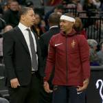 Cleveland head coach Tyronn Lue talks with Cavaliers guard Isaiah Thomas before a game against the Sacramento on Dec. 27, 2017 in Sacramento, California. Thomas, who was acquired from Boston in the off season, has not played this season due to a hip injury. He is expected to begin playing for the Cavaliers on Tuesday. (AP Photo/Rich Pedroncelli)