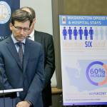 Washington Attorney General Bob Ferguson (second from left) listens to a question at a Sept. 28 news conference in Seattle announcing a lawsuit against several makers of opioids, including Purdue Pharma. (AP Photo/Ted S. Warren)