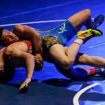 Stanwoods Riley Van Scoy (bottom) tries to roll away from Japans Terumasa Tashiro during an exhibition match at Everett High School on Friday, Jan. 5. (Ian Terry / The Herald)