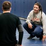 Glacier Peak wrestler Kiley Hubby (right) talks with coach Cameron Kuehn during a team practice on Jan. 4 in Snohomish. Hubby made an impression on college coaches by winning a tournament in California in mid-December. (Ian Terry / The Herald)