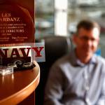 In corners and on shelves in Les Reardanzs office, the United States Navy maintains a presence. Now, the Port of Everett CEO and naval reservist will spend the better part of a year in Afghanistan. (Dan Bates / The Herald)