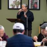Hau Tran sings as Vietnamese seniors eat at Homages Center for Healthy Living on Jan. 10 in Lynnwood. Each weekday the center offers its room for various cultures to get together for activities and lunch while speaking their native languages. (Andy Bronson / The Herald)