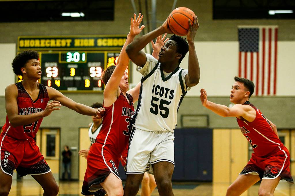 Shorecrests Philip Pepple (55) takes a shot amid a swarm of Marysville Pilchuck defenders during a game Jan. 9, 2018, at Shorecrest High School in Shoreline. (Ian Terry / The Herald)