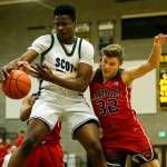 Shorecrests Philip Pepple (left) snatches a rebound away from Marysville Pilchucks Aaron Kalab (right) during a game Jan. 9, 2018, at Shorecrest High School in Shoreline. (Ian Terry / The Herald)