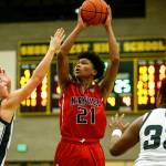 Marysville Pilchucks RaeQuan Battle (center) takes a shot as Shorecrests Chris Lee (left) and Eladio Fountain (right) defend during a game Jan. 9, 2018, at Shorecrest High School in Shoreline. (Ian Terry / The Herald)