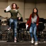 Kamiak students Paige Cox (left) and Lauren Bocalan do their best to enunciate their lines while also pretending to ride a horse during an audition for Spamalot at the Mukilteo school. Both were cast. (Ian Terry / The Herald)