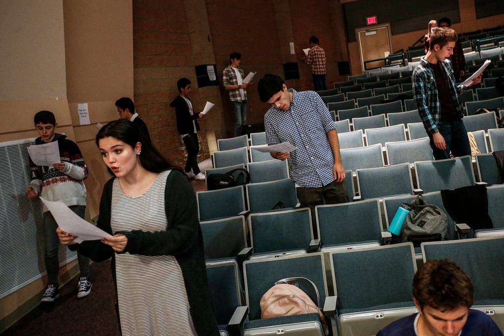 Students take a few moments to go over their lines. (Ian Terry / The Herald)